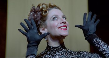Movie still from “All That Jazz” (1979), directed by Bob Fosse – A person wearing gloves and a dress; Close Up shot, Low angle