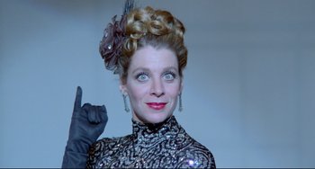 Movie still from “All That Jazz” (1979), directed by Bob Fosse – A woman in a black dress and gloves; Close Up shot, Low angle