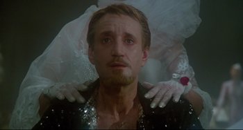Movie still from “All That Jazz” (1979), directed by Bob Fosse – A person with a hand on his shoulder; Close Up shot, Low angle