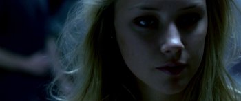 Movie still from “All the Boys Love Mandy Lane” (2006), directed by Jonathan Levine – A woman's face in the dark; Extreme Close Up shot, Low angle