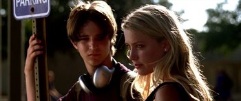 Movie still from “All the Boys Love Mandy Lane” (2006), directed by Jonathan Levine – A man and a woman wearing headphones and looking at the camera; Close Up shot, Low angle