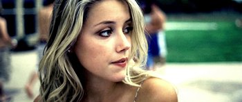 Movie still from “All the Boys Love Mandy Lane” (2006), directed by Jonathan Levine – A person with long blonde hair; Close Up shot, Low angle