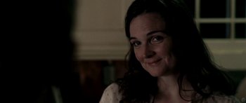 Movie still from “All the Boys Love Mandy Lane” (2006), directed by Jonathan Levine – A person smiling for the camera; Close Up shot, Over the shoulder angle