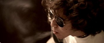 Movie still from “All the Boys Love Mandy Lane” (2006), directed by Jonathan Levine – A young man wearing a pair of sunglasses; Extreme Close Up shot, Low angle