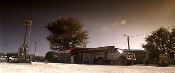 Movie still from “All the Boys Love Mandy Lane” (2006), directed by Jonathan Levine – An old truck parked in front of an old gas station; Extreme Wide shot, Low angle