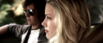 Movie still from “All the Boys Love Mandy Lane” (2006), directed by Jonathan Levine – A person wearing sunglasses; Close Up shot, Low angle