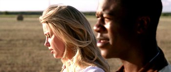 Movie still from “All the Boys Love Mandy Lane” (2006), directed by Jonathan Levine – A man and a woman standing next to each other in a field; Close Up shot, Low angle