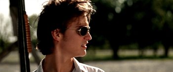 Movie still from “All the Boys Love Mandy Lane” (2006), directed by Jonathan Levine – A young man wearing sunglasses looking to his left; Close Up shot, Low angle