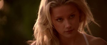 Movie still from “All the Boys Love Mandy Lane” (2006), directed by Jonathan Levine – A woman's face with long blonde hair; Close Up shot, Over the shoulder angle