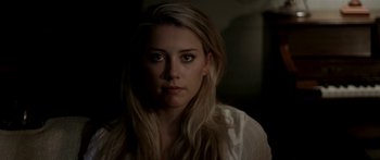 Movie still from “All the Boys Love Mandy Lane” (2006), directed by Jonathan Levine – A woman with long blonde hair stares into the camera; Close Up shot, Over the shoulder angle