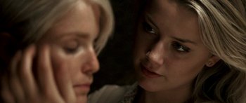 Movie still from “All the Boys Love Mandy Lane” (2006), directed by Jonathan Levine – Two young women looking at each other with one of the women looking at the other; Close Up shot, Over the shoulder angle