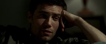 Movie still from “All the Boys Love Mandy Lane” (2006), directed by Jonathan Levine – A person with his hand on his head; Close Up shot, Low angle