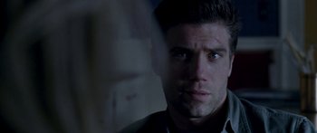 Movie still from “All the Boys Love Mandy Lane” (2006), directed by Jonathan Levine – A man's face in a dark room; Close Up shot, Over the shoulder angle