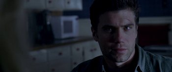 Movie still from “All the Boys Love Mandy Lane” (2006), directed by Jonathan Levine – A person in a kitchen; Close Up shot, Over the shoulder angle