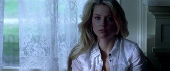 Movie still from “All the Boys Love Mandy Lane” (2006), directed by Jonathan Levine – A beautiful young woman in a white shirt; Close Up shot, Low angle