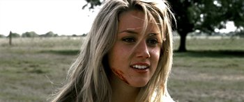 Movie still from “All the Boys Love Mandy Lane” (2006), directed by Jonathan Levine – A beautiful young blonde woman with blood on her face; Close Up shot, Low angle