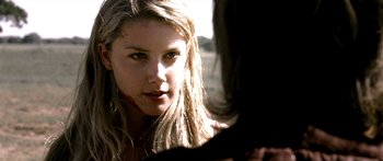 Movie still from “All the Boys Love Mandy Lane” (2006), directed by Jonathan Levine – A person with long blonde hair; Close Up shot, Over the shoulder angle