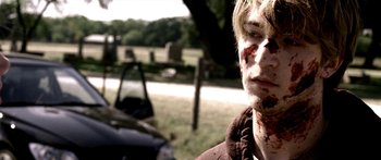 Movie still from “All the Boys Love Mandy Lane” (2006), directed by Jonathan Levine – A young man with blood all over his face; Close Up shot, Over the shoulder angle