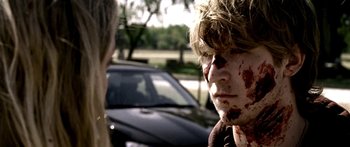 Movie still from “All the Boys Love Mandy Lane” (2006), directed by Jonathan Levine – A young man with blood all over his face; Close Up shot, Over the shoulder angle