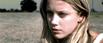 Movie still from “All the Boys Love Mandy Lane” (2006), directed by Jonathan Levine – A person with long brown hair; Close Up shot, Low angle