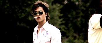 Movie still from “All the Boys Love Mandy Lane” (2006), directed by Jonathan Levine – A man with sunglasses and a cigarette in his mouth; Close Up shot, Low angle