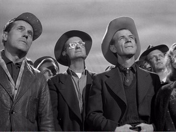 Movie still from “All the King's Men” (1949), directed by Robert Rossen – A black and white photo of a group of men wearing hats; Medium shot, Low angle