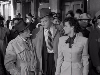 Movie still from “All the King's Men” (1949), directed by Robert Rossen – A group of men and women standing next to each other; Medium shot, High angle