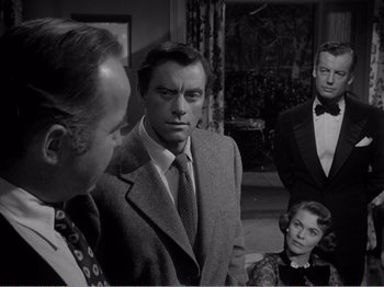 Movie still from “All the King's Men” (1949), directed by Robert Rossen – A group of men and a woman standing next to each other in a room; Medium shot, Over the shoulder angle