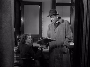 Movie still from “All the King's Men” (1949), directed by Robert Rossen – An old photo of a man and a woman looking at each other; Medium shot, High angle