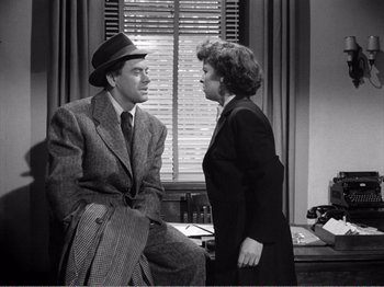 Movie still from “All the King's Men” (1949), directed by Robert Rossen – An old photo of a man and a woman talking; Medium shot, High angle