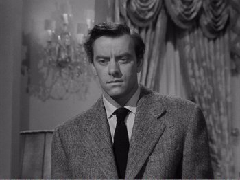 Movie still from “All the King's Men” (1949), directed by Robert Rossen – A black and white photo of a man in a suit and tie; Close Up shot, Low angle