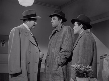 Movie still from “All the King's Men” (1949), directed by Robert Rossen – A group of men standing next to each other wearing hats; Medium shot, Low angle