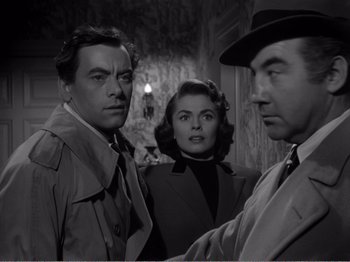 Movie still from “All the King's Men” (1949), directed by Robert Rossen – A man and two women standing next to each other in a room; Medium shot, Low angle