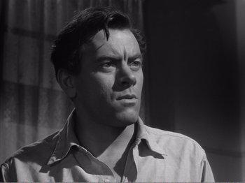 Movie still from “All the King's Men” (1949), directed by Robert Rossen – Black and white photograph of a man looking up; Close Up shot, Low angle