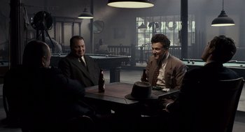 Movie still from “All the King's Men” (2006), directed by Steven Zaillian – A group of men sitting at a table in a room; Wide shot, High angle