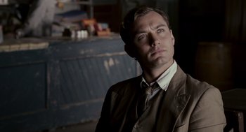 Movie still from “All the King's Men” (2006), directed by Steven Zaillian – A person wearing a suit and tie; Close Up shot, Over the shoulder angle