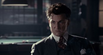 Movie still from “All the King's Men” (2006), directed by Steven Zaillian – A person wearing a suit and tie; Close Up shot, Low angle