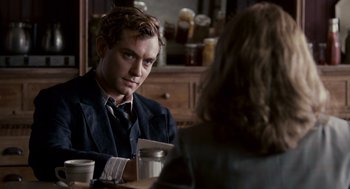 Movie still from “All the King's Men” (2006), directed by Steven Zaillian – A man sitting at a table with a woman in front of him; Close Up shot, Over the shoulder angle