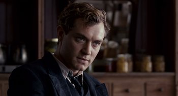 Movie still from “All the King's Men” (2006), directed by Steven Zaillian – A person wearing a suit and tie; Close Up shot, Over the shoulder angle