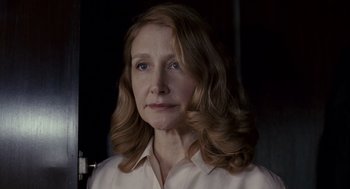 Movie still from “All the King's Men” (2006), directed by Steven Zaillian – A person with long hair; Close Up shot, Low angle