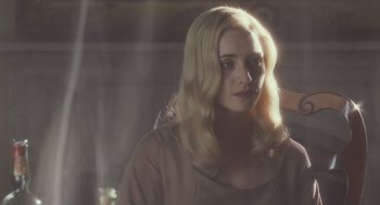 Movie still from “All the King's Men” (2006), directed by Steven Zaillian – A woman with long blonde hair sitting in front of a window; Close Up shot, Over the shoulder angle
