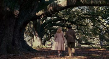 Movie still from “All the King's Men” (2006), directed by Steven Zaillian – A man and a woman walking through the woods; Wide shot, High angle