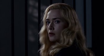 Movie still from “All the King's Men” (2006), directed by Steven Zaillian – A person with blonde hair; Close Up shot, Low angle