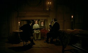 Movie still from “Tous les matins du monde” (1991), directed by Alain Corneau – A group of people sitting in a living room playing music; Wide shot, High angle