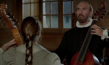 Movie still from “Tous les matins du monde” (1991), directed by Alain Corneau – A man and a woman are playing a cello; Medium shot, Over the shoulder angle