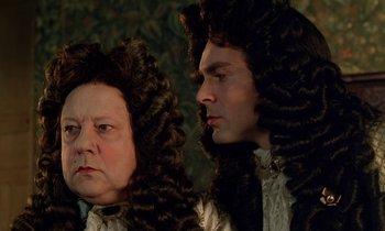 Movie still from “Tous les matins du monde” (1991), directed by Alain Corneau – A man and a woman with long curly hair; Close Up shot, Over the shoulder angle