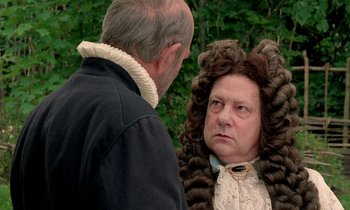 Movie still from “Tous les matins du monde” (1991), directed by Alain Corneau – An older man and a younger woman wearing wigs and garb; Close Up shot, Over the shoulder angle