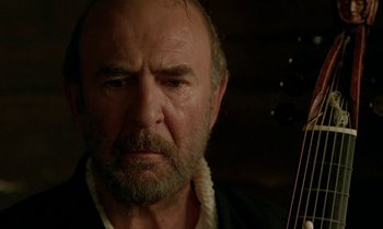 Movie still from “Tous les matins du monde” (1991), directed by Alain Corneau – An old man with a beard and a mustache is looking at the camera; Close Up shot, Low angle