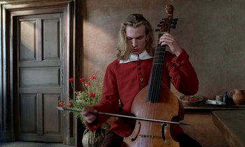 Movie still from “Tous les matins du monde” (1991), directed by Alain Corneau – A man in a red shirt is playing a cello; Medium shot, Low angle