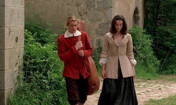 Movie still from “Tous les matins du monde” (1991), directed by Alain Corneau – A man and a woman walking down a path; Wide shot, Low angle